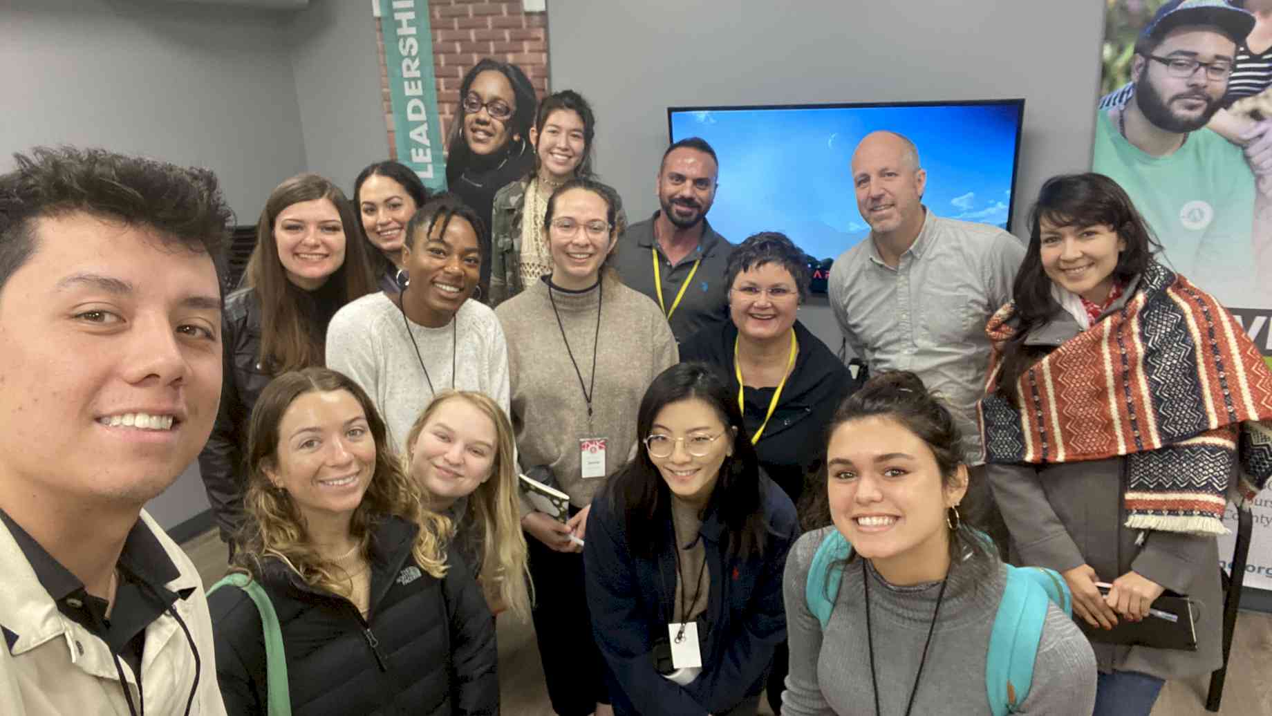 Mint + MXD Students and faculty at Project YouthBuild, with Executive Director Jonathan Leslie (spring 2020)