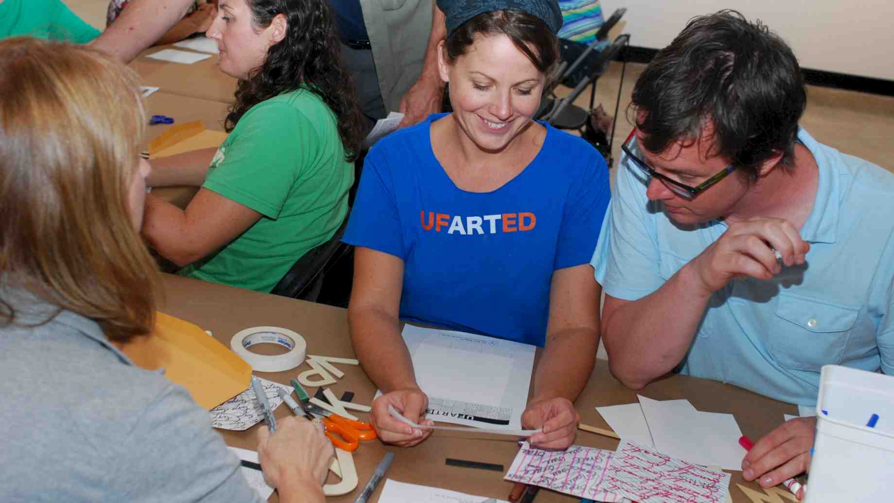 Online MA students share a moment during Summer Studio classes on campus.