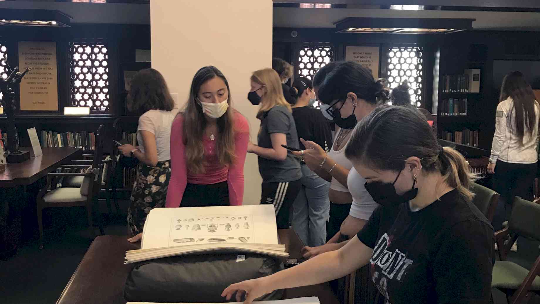 Students from ARH2613 Intro to Latin American Art (taught by Dr. Stanfield-Mazzi) at the Special & Area Studies Collections department of UF Smathers Library.