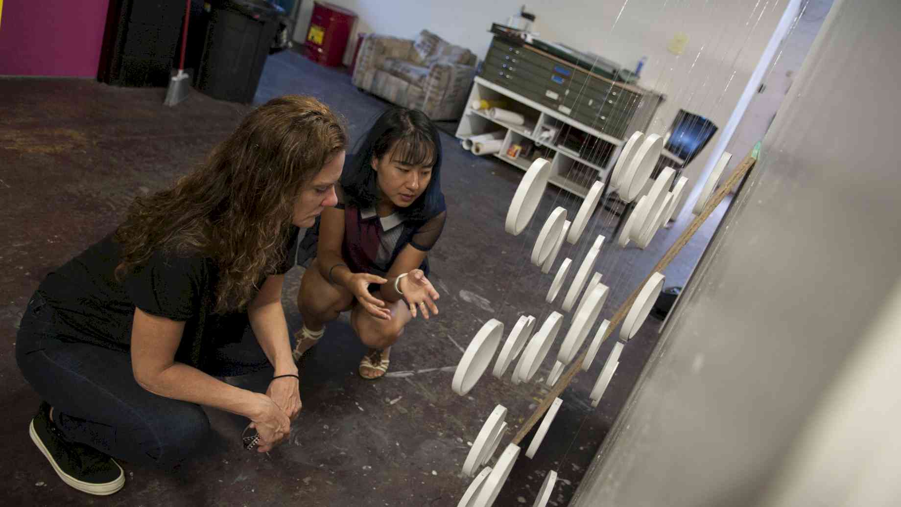 Visiting Artist Andrea Bowers conducts a studio visit with Painting / Drawing grad Ye Ma