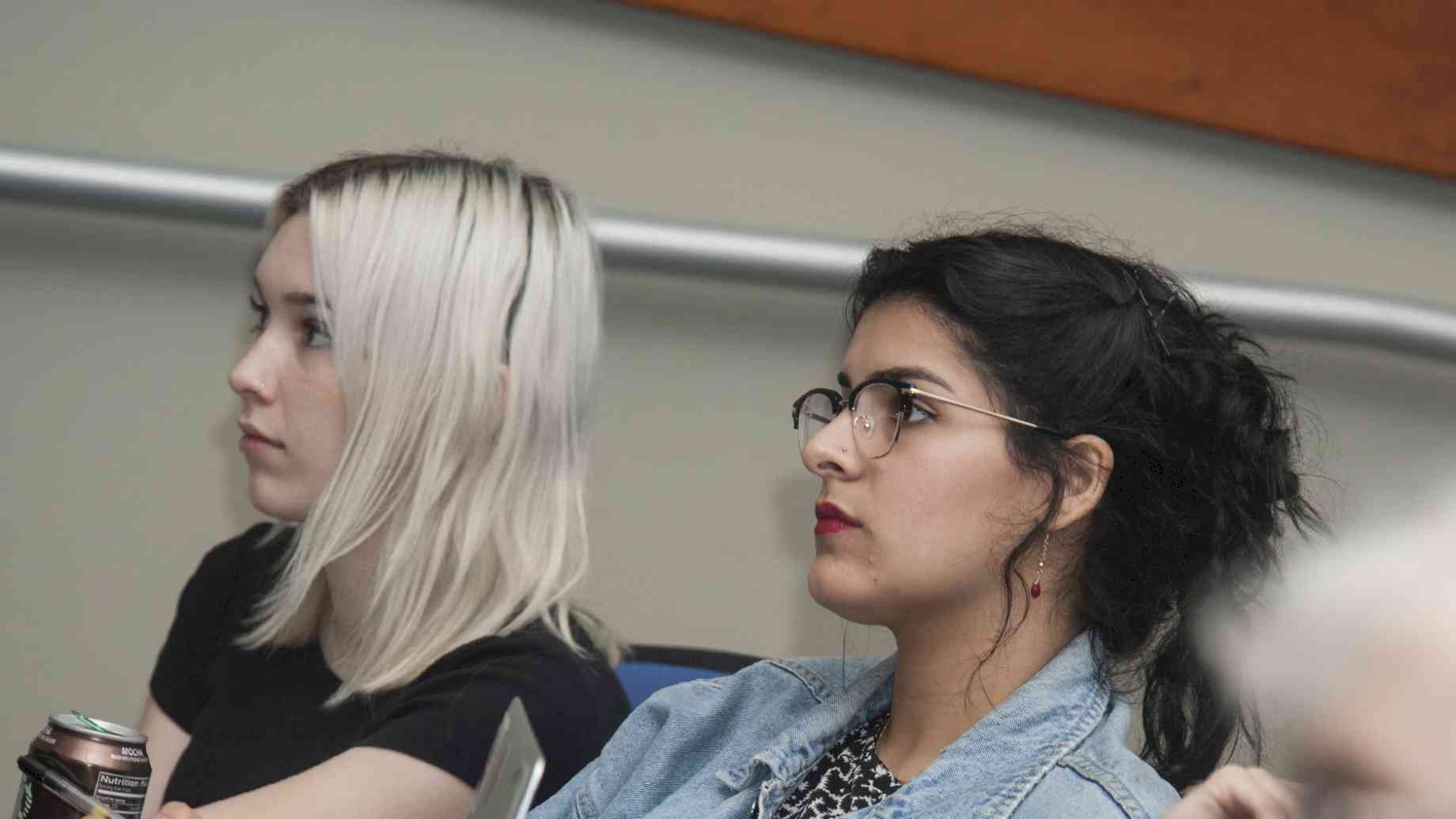 Audience members listening to Martins